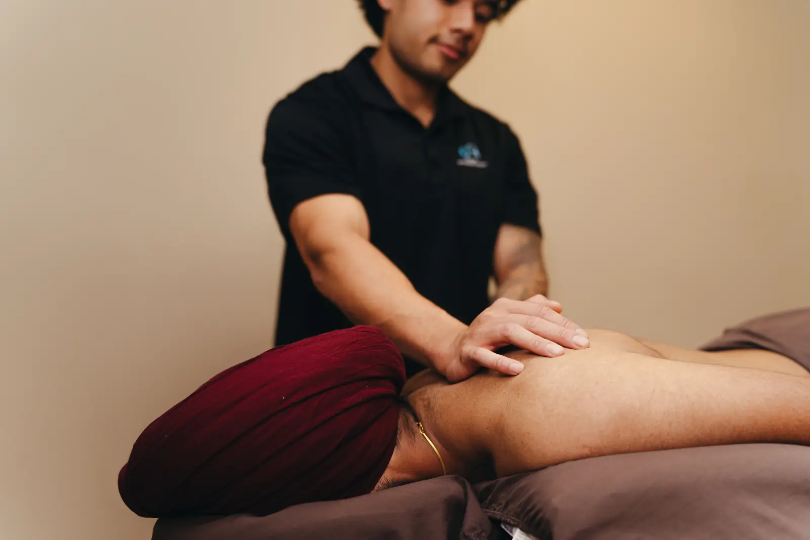 A registered massage therapist's hands during a treatment