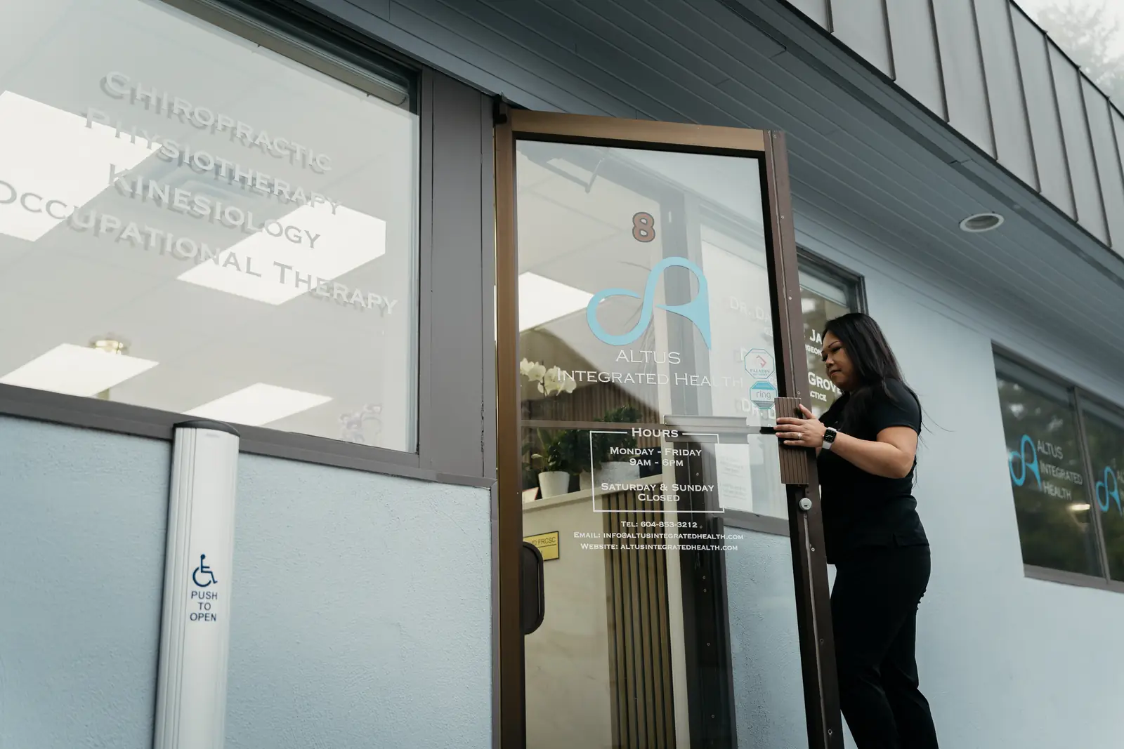 Dr. Trang Luu-Grover opening the door of the McCallum Road clinic